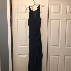 Floor length navy dress.